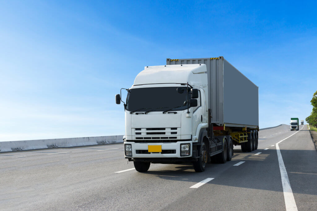 Truck on highway road with container, transportation concept.,import,export logistic industrial Transporting Land transport on the asphalt expressway.