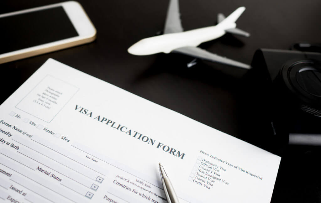 Filling travel Visa application form for vacation