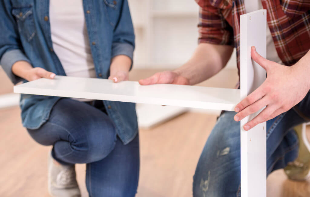 Close-up of young couple move into their new house.